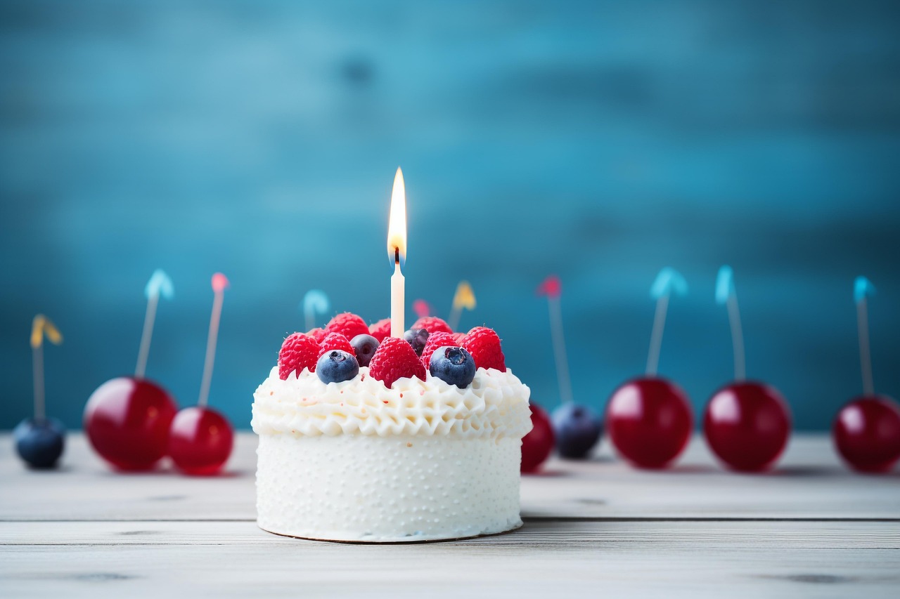 Birthday cake with lit candles at a celebration